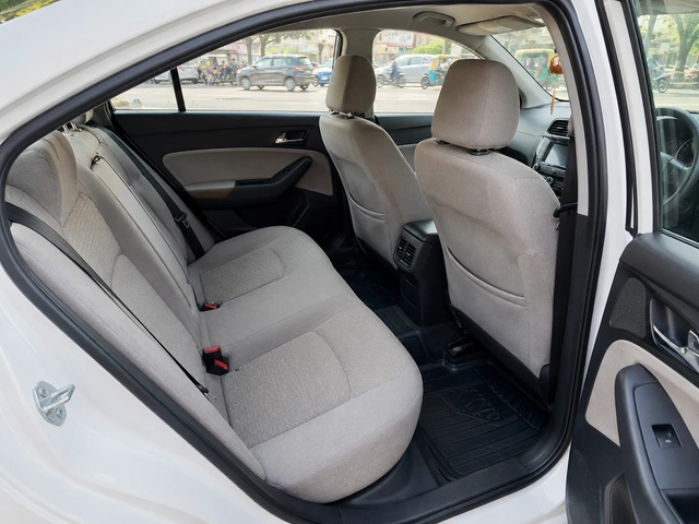 Clean air conditioned sedan taxi interior offered for local rides in Bhopal